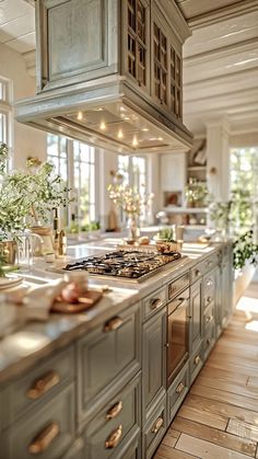 a large kitchen with an oven, stove and counter tops in the middle of it