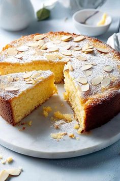 a cake that has been cut into pieces and is on a plate with one slice missing