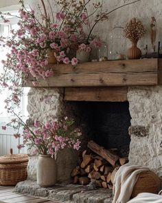 a living room filled with furniture and flowers on top of a fireplace mantel next to a fire place