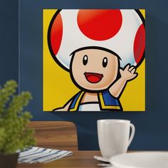 a painting of a person with a mushroom on his head is hanging above a dining room table