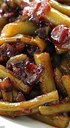 close up view of french fries with bacon and ketchup