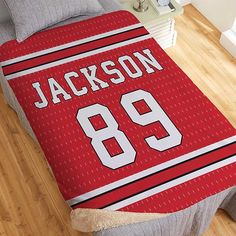 a bed with a basketball jersey on it and the number 89 printed on the cover