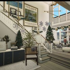 a living room filled with lots of furniture and christmas tree decorations on the wall next to stairs