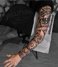 a man's arm with tattoos on it