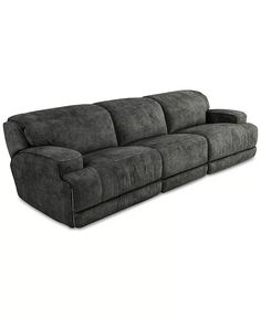 a large gray couch sitting on top of a white floor