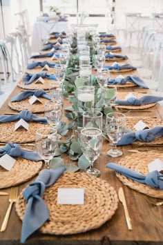 the table is set with place settings and napkins for guests to sit down at