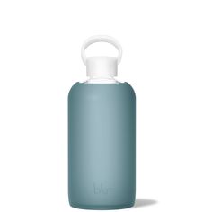 a blue water bottle with a white top and handle on it's side, sitting in front of a white background