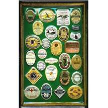 a green and gold framed display with many different badges on it