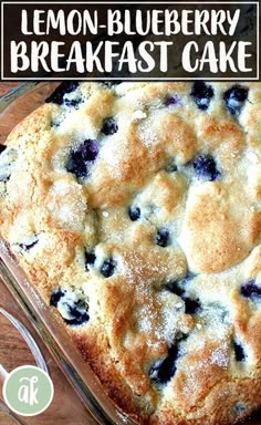 a lemon blueberry breakfast cake in a glass baking dish on a wooden table with the words lemon blueberry breakfast cake above it