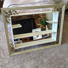 a large mirror sitting on top of a carpeted floor