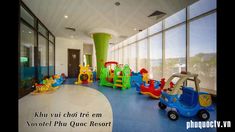 children's play area with colorful toys and large windows