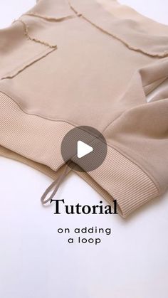 the video shows how to make a sweater with an open hoodie and zippers