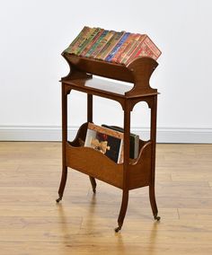 a wooden book stand with books on it