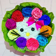 a hello kitty made out of felt flowers