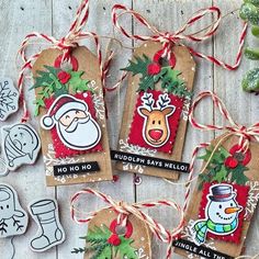 three tags with christmas decorations on them