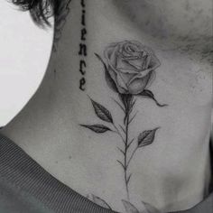 a neck tattoo with a rose on it