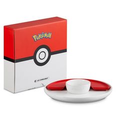 the pokemon poke ball bowl and saucer set is in front of a boxed box