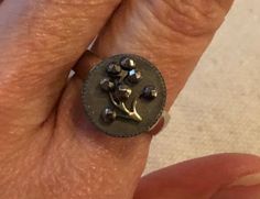 "Floral Antique Button Ring (adjustable band) - Beautiful medium-sized Victorian-era antique button ring.  The button has been mounted on a nickel-free adjustable band so perfect for all standard finger sizes. Button is 9/16\".   Great for the antique button collector or any jewelry lover.  Would make an excellent Valentines Day, Mother's Day, anniversary, birthday gift or to celebrate any special occasion" Necklace Combo, Button Ring, Antique Buttons, Button Jewelry, Jewelry Lover, Victorian Era, Green And Gold, Etsy App, Mother's Day