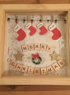 a wooden frame with christmas stockings hanging from it