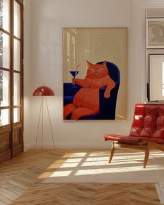 an orange cat is sitting on a red chair in front of a framed art piece