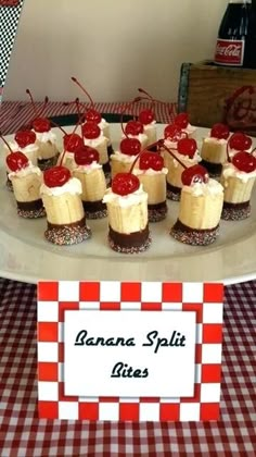 there are many desserts on the table with red and white checkered tablecloth