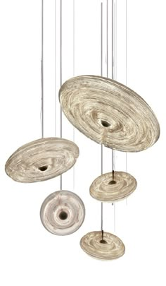 a group of circular objects hanging from strings