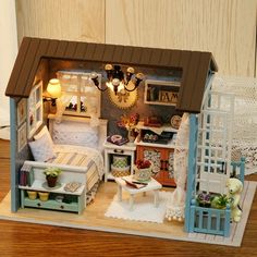 a miniature doll house with furniture and accessories