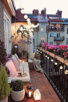 an outdoor patio with candles on the table