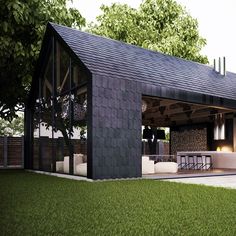 an image of a house that is made out of wood and black shinnings