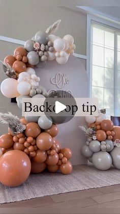 balloons are arranged in the shape of letters and numbers on a wall with words back - up