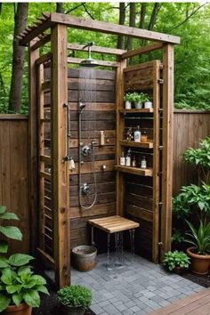 an outdoor shower in the middle of a garden