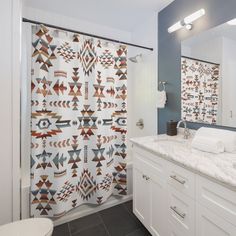 a bathroom with a shower, toilet and sink in the same color as the walls