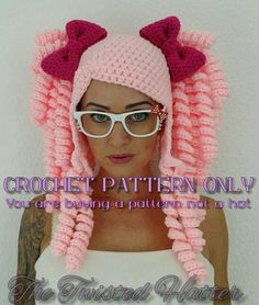 a woman wearing a pink crochet hat with bows