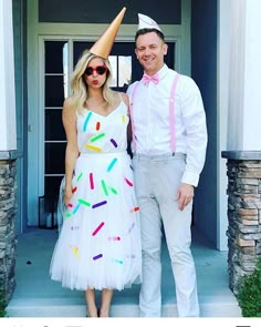 a man and woman dressed up for a birthday party with confetti on their hats