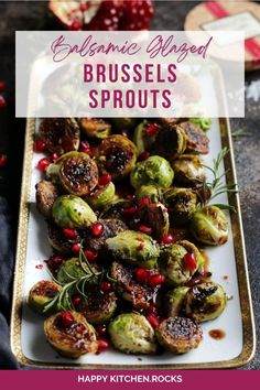 brussel sprouts with pomegranate and herbs on a white plate