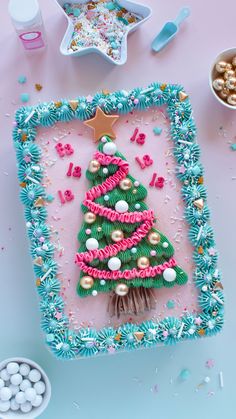 a decorated christmas tree in a frame surrounded by confetti and sprinkles