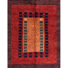 an orange, blue and black rug with squares on the center is in front of a white background