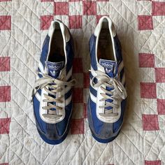 Calling all Sneakerheads! Original 1970s 1980s Adidas Dragon running shoes in royal blue nylon and suede with white leather stripes and trim, and foam and rubber soles. A very cool addition to any vintage sneaker completist's collection. THESE SHOES ARE NOT WEARABLE, they are being sold for display and study only. The soles have offgassed and as a result, the rubber no longer bends. Additionally, the blue rubber at the tips of the toes is cracking and falling off and the blue sometimes comes off when touched. Label: Adidas - Dragon - Made in Taiwan Approximate size: US W 8 / M 6 Exterior length: 11 in Exterior width across ball of foot: 4 Please DM us with any queastions and follow us on Instagram @vacationsf ! Blue Sneakers With Vented Sides For Streetwear, Vintage Blue Sneakers With Rubber Waffle Outsoles, Retro Blue Sneakers With Laces, Vintage Blue Sneakers With Round Toe, Dragon Running, Vintage Blue Sneakers With Rubber Sole, Blue And White Sneakers, Blue Textile Sneakers For Streetwear, Vintage Blue Sneakers For Streetwear