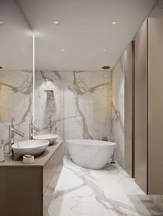 a bathroom with marble walls and flooring, two sinks and a bathtub in the middle