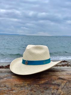 Ocean Western is a Southern-inspired Panama hat made for the long haul. It features a 3 ½” stiffened brim with raised edges and a wire to hold its shape. Handwoven from 100% Toquilla straw and finished with a handcrafted leather hatband, teardrop pinched crown and a sea turtle pin for details. The Ocean Western Panama hat was created with the purpose of donating 5% of each Ocean Western sold to the Sea Turtle Conservancy, the world’s oldest sea turtle research and conservation group that carries Short Brim Straw Hat For Western-themed Events, Straw Hat Bands With Short Brim For Rodeo, Straw Hat With Short Brim For Western-themed Events, Short Brim Straw Sun Hat For Western-themed Events, Brimmed Straw Ranch Hats, Brimmed Straw Hat For Rodeo, Western Straw Brimmed Fedora, Straw Sun Hat With Short Brim For Western-themed Events, Straw Brimmed Western Hat