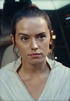 a woman in a star wars scene looking at the camera with an angry look on her face