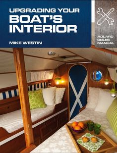 the inside of a boat's interior with two beds and a table in it