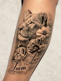 a woman's leg with a lion and flowers tattoo on her arm, which reads lucas live