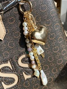 This piece of jewelry can be used as a bag charm, a keychain, or a decoration for any other item. Tou * Gold: Brass/copper/St.steel + 18K Gold plated * Platinum: Brass/copper/St.steel + Rhodium plated * Freshwater&Baroque pearls; Natural Jasper/Tourmaline stones; Zircon pendants * All pendants are Removable * No risk of allergy (nickel-free, lead-free, cadmium-free) * Full length: 13 cm * The shape and color of the stones and pearls may vary * Delivered with a cleaning cloth and a ready-to-gift Bag Charms Aesthetic 2024, Bag Charm Inspiration, Backpack Charms Aesthetic, Handbag Charms Diy, Charm Bag Aesthetic, Purse Keychain Aesthetic, Key Chain Charms, Purse Charms Aesthetic, Bag Charms Ideas