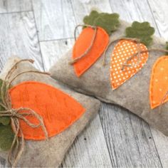 two pieces of felt with carrots on them