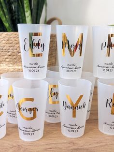 the cups have gold foil on them and are labeled with each other's initials