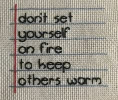 a piece of fabric with the words don't set yourself on fire to keep others warm