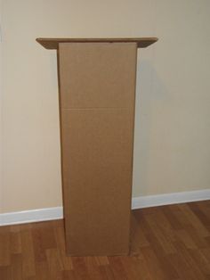 an empty podium stands in front of a wall