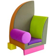 a colorful chair sitting on top of a wooden block