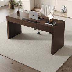 an office desk with a laptop on it in front of a white carpeted floor